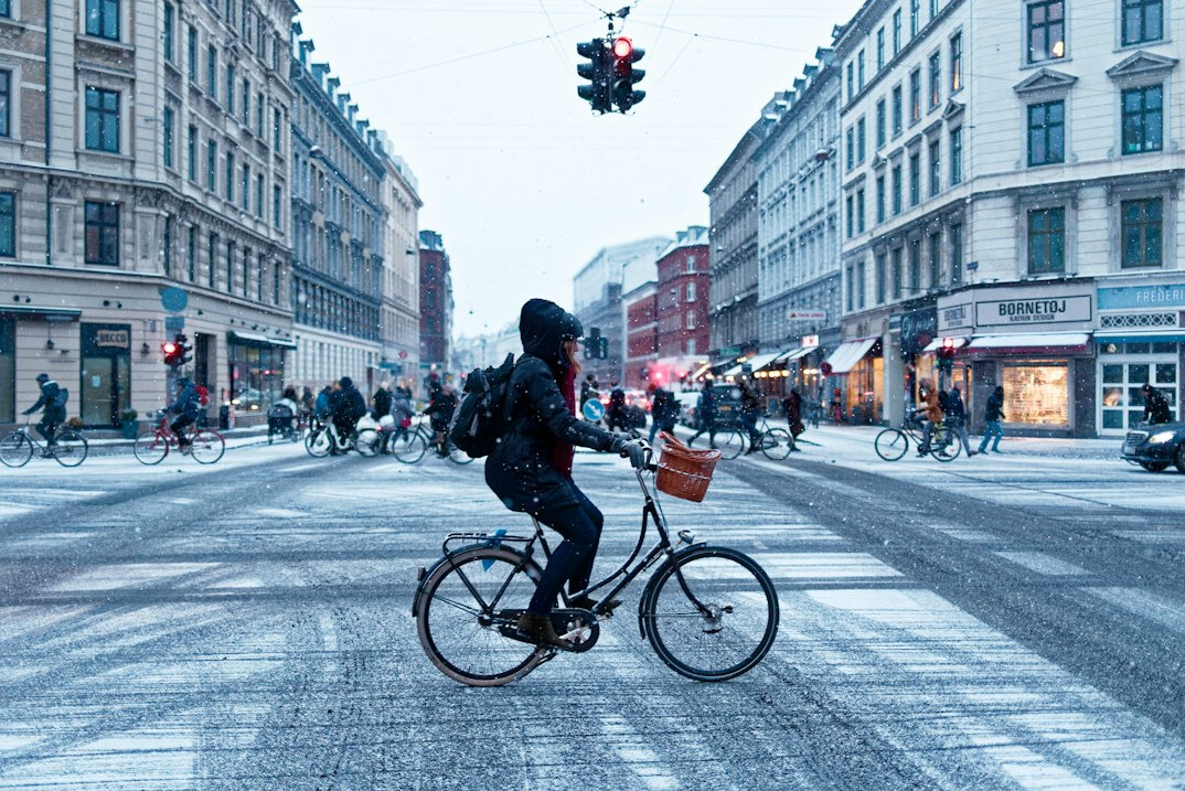 Danish cyclists riding through a Copenhagen street
