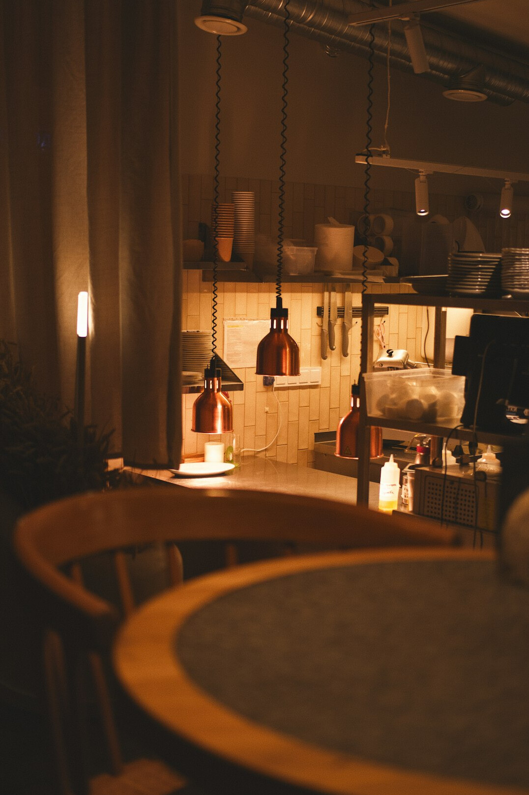 Cozy Danish cafe interior with warm lighting and candles